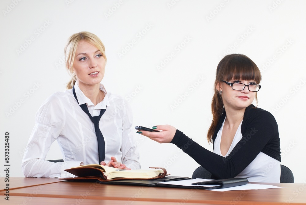 Meeting of attractive young businesswomen in office Meeting of attractive young businesswomen in office