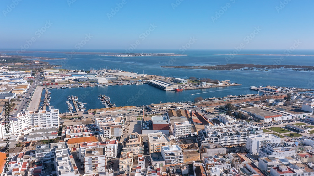 Aerial view of the Portuguese fishing tourist town of Olhao overlooking the Ria Formosa Marine Park. fishing port of fish trade