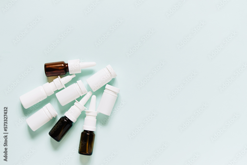 Set of different white and brown medicine bottles, pill bottles without label design, copy space on blue background
Set of different white and brown medicine bottles, pill bottles without label design, copy space on blue background