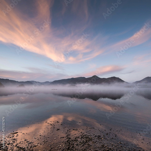 View of Derwentwater reflecting the sky on a still Autumn 