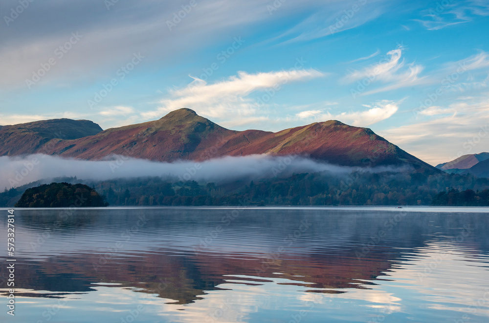 View acroos Derwentater in the Lake District on a misty dawn morning