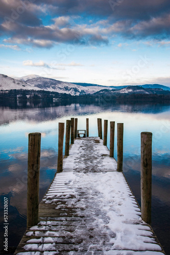 View acroos a Derwentwater landing stage on a snowy winter s day