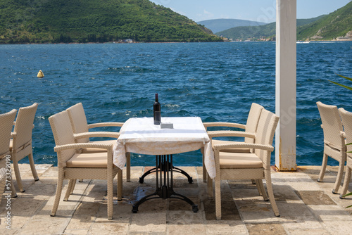 Typical seaside restaurant overlooking the beautiful Bay of Kotor in Montenegro. Europe