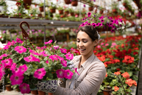 Florists Women Working With Flowers In A Greenhouse