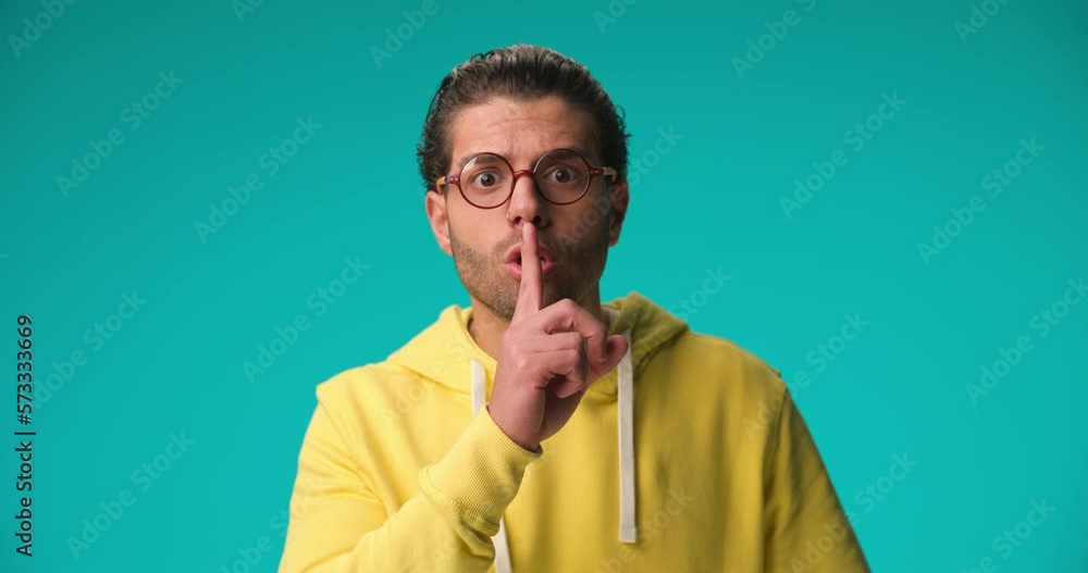 casual man asking for silence with an aggressive attitude casual man asking for silence with an aggressive attitude