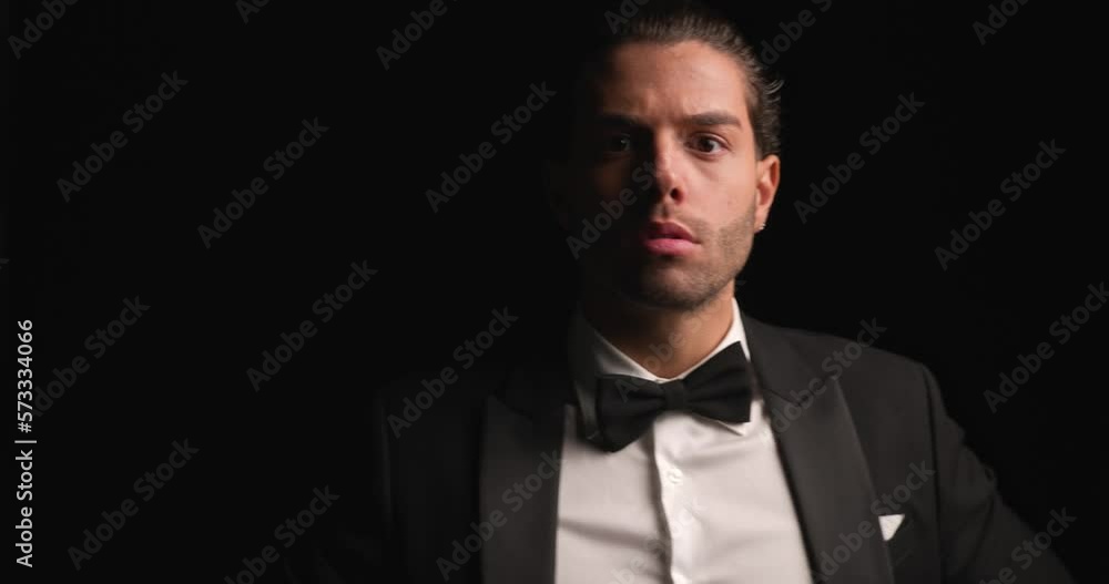 young businessman walking in, posing with a tough look and leaving young businessman walking in, posing with a tough look and leaving