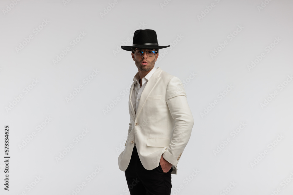 smart casual man with hands in pockets looking shocked smart casual man with hands in pockets looking shocked