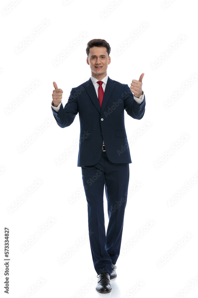 businessman walking and giving a thumbs up businessman walking and giving a thumbs up
