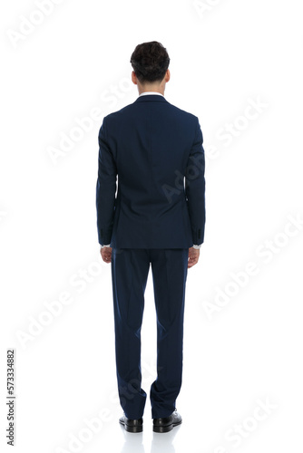 businessman turning his back at the camera