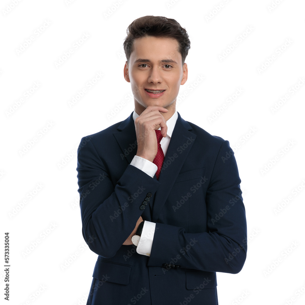 businessman crossing arms, scratching chin and smiling businessman crossing arms, scratching chin and smiling