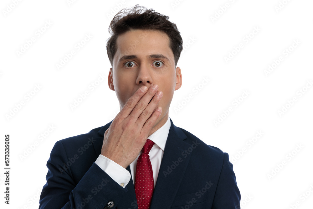 businessman slapping his mouth and feeling shocked businessman slapping his mouth and feeling shocked