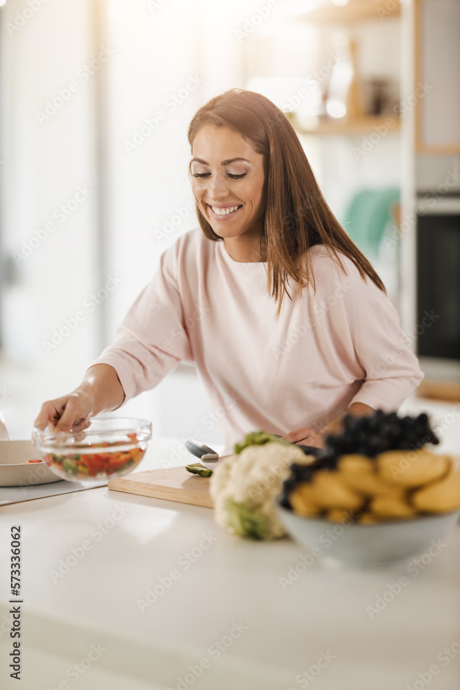 Woman Preparing A Healthy Meal In The Kitchen