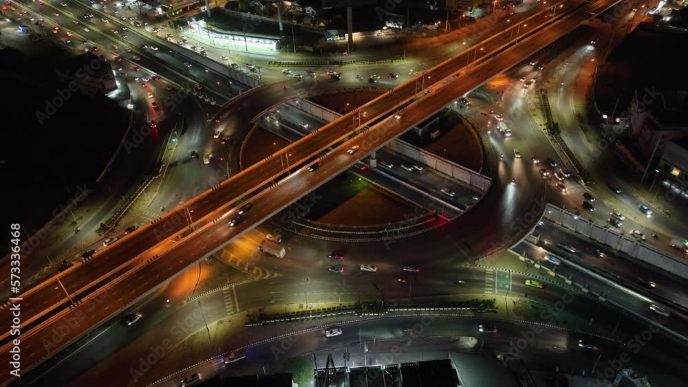 car traffic transportation above circle roundabout road in Asian city. Drone aerial view fly in circle, high angle. Public transport or commuter city life concept
car traffic transportation above circle roundabout road in Asian city. Drone aerial view fly in circle, high angle. Public transport or commuter city life concept