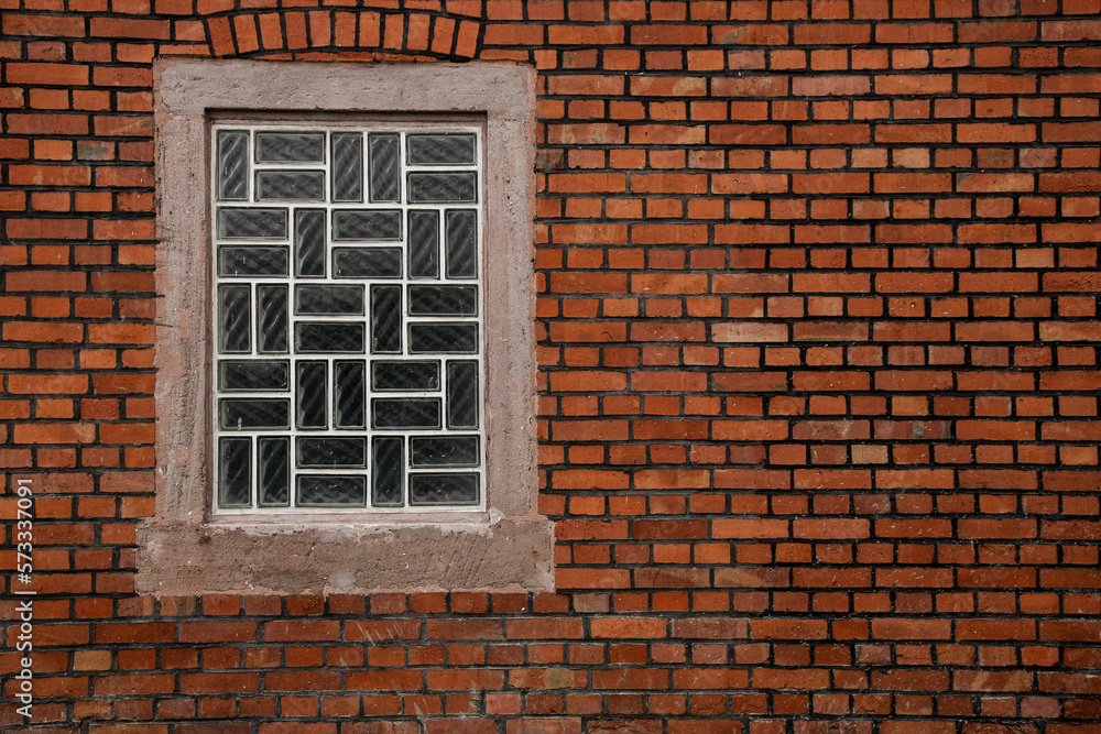 Glass brick window in brick wall with space for text and bakcground, no person