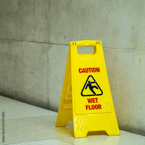 Wet floor warning sign in a public building