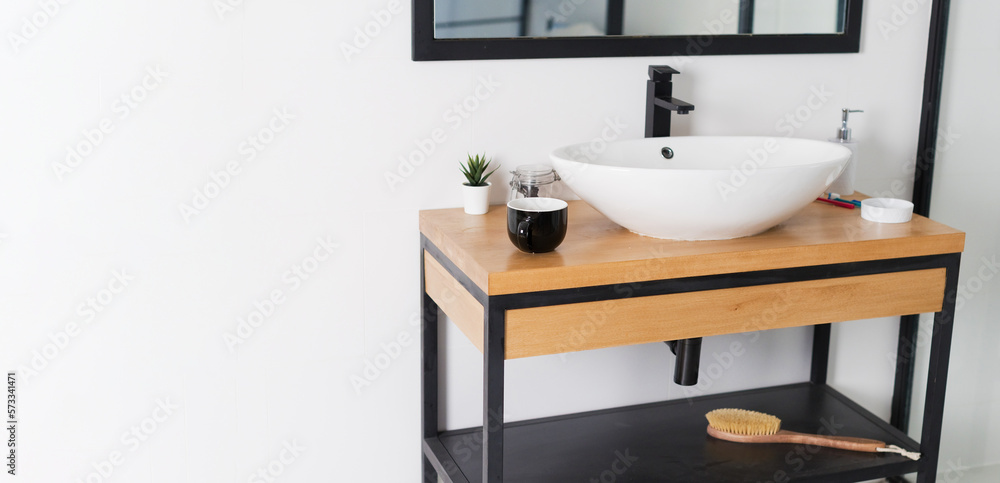 Minimalist bathroom with sink wooden table