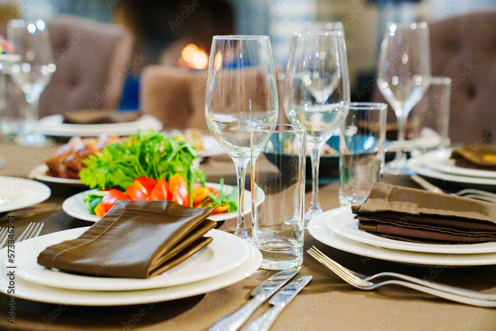 Fototapeta premium a festive served table with snacks and tableware.