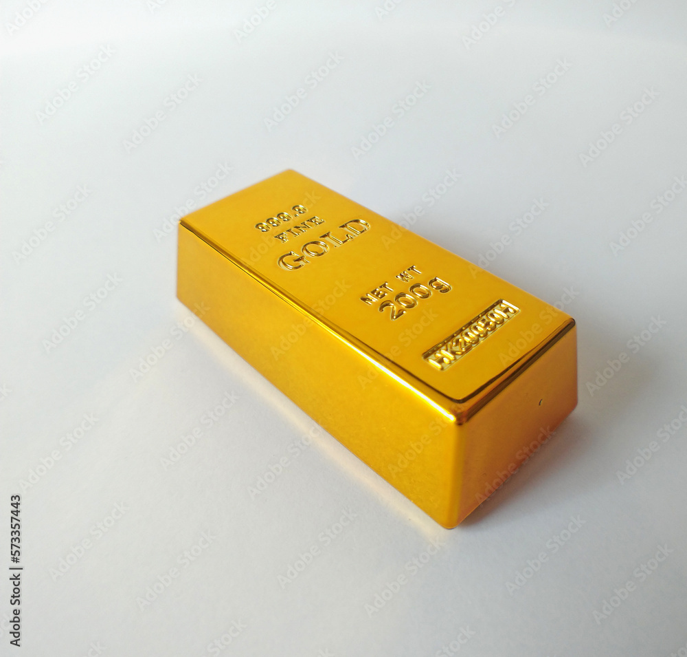 golden ingot of the highest standard on a white background. investments in precious metals and capital multiplication. rejection of paper money golden ingot of the highest standard on a white background. investments in precious metals and capital multiplication. rejection of paper money