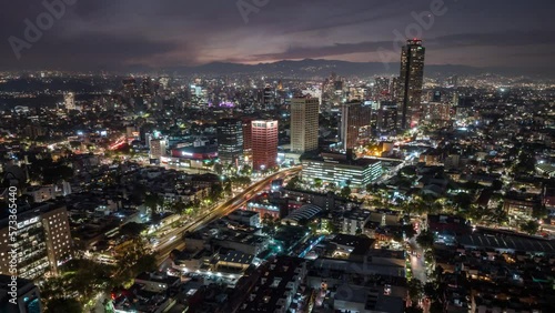 Beautiful aerial hyperlapse footage of the capital of Mexico city at night.