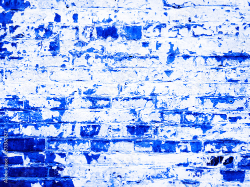 Light blue bright grunge texture of an old red brick wall with damage and peeling paint. Gradient background. 4k wallpaper with toned texture. Place for text for designer. Wide panoramic banner