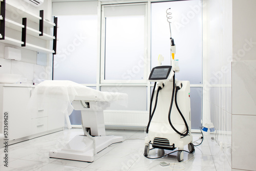 modern nordlys machine, equipment in cosmetology clinic, cosmetology room with couch and laser machines photo