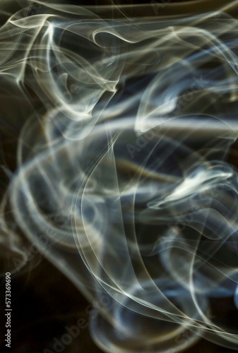 white smoke against black background