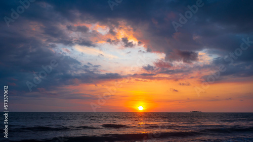 Sunset in the sea with dramatic sky © Johnster Designs