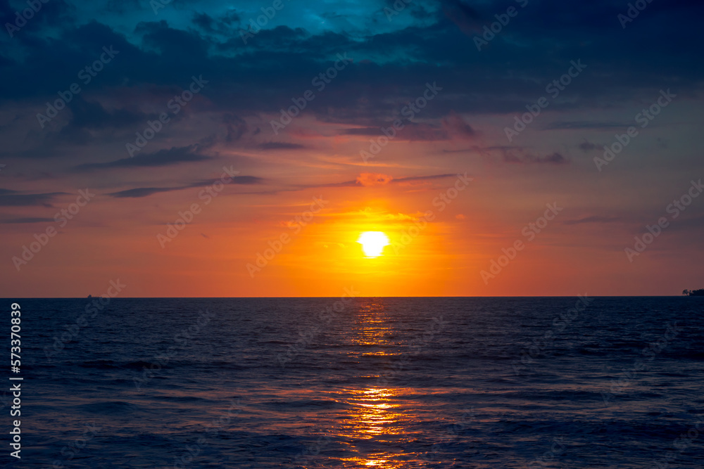 Sunset in the sea with dramatic sky