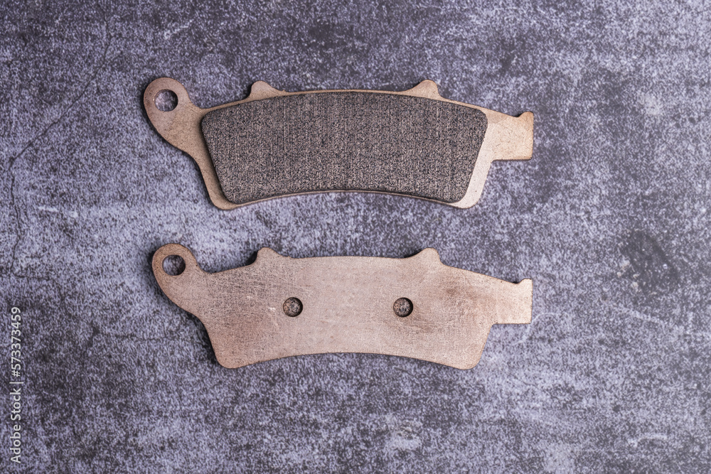 Metallic pads with unused motorcycle front brake lining