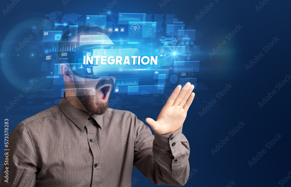 Businessman looking through Virtual Reality glasses Businessman looking through Virtual Reality glasses