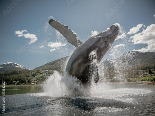 Juneau, Alaska, United States of America. Statue of a Big Wale jumping out from water in a small touristic town.