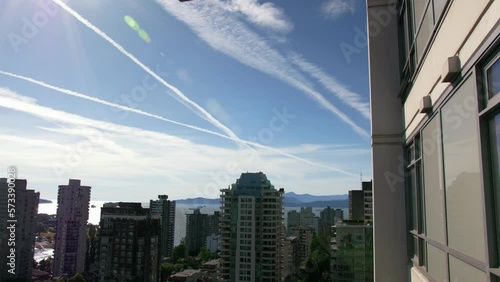 Downtown Vancouver, British Columbia, Canada chemtrails in the sky photo