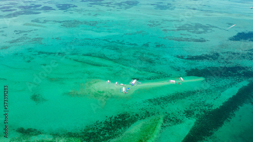 Sandbar and coral reef in turquoise water. Negros, Philippines.