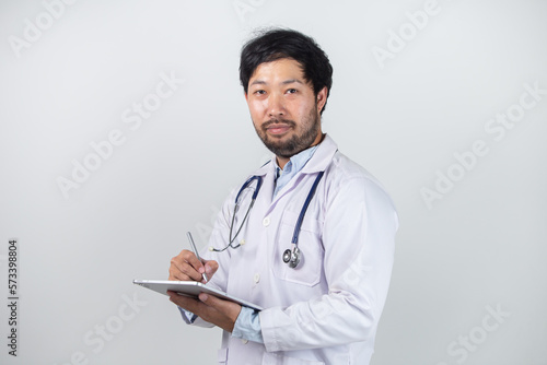 Medicine doctor with stethoscope touching medical icon network connection and modern interface on digital tablet on hospital background. Medical technology network concept