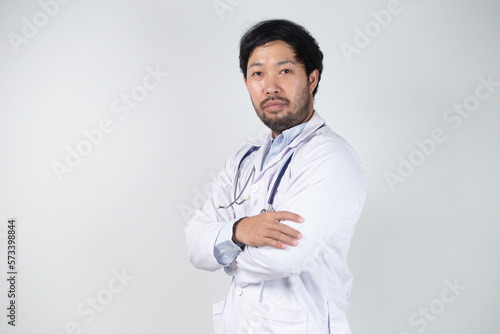 Asian man in Doctor uniform on white background in hospital