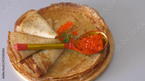 Pancakes with red caviar, cooked for Maslenitsa. Maslenitsa is an East Slavic traditional holiday celebrated during the week before Lent.