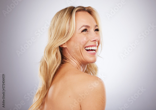 Happy, skincare and mature woman in studio for beauty, wellness and grooming on grey background space. Cosmetic, body care and female model relax in luxury, hygiene and dermatology while isolated