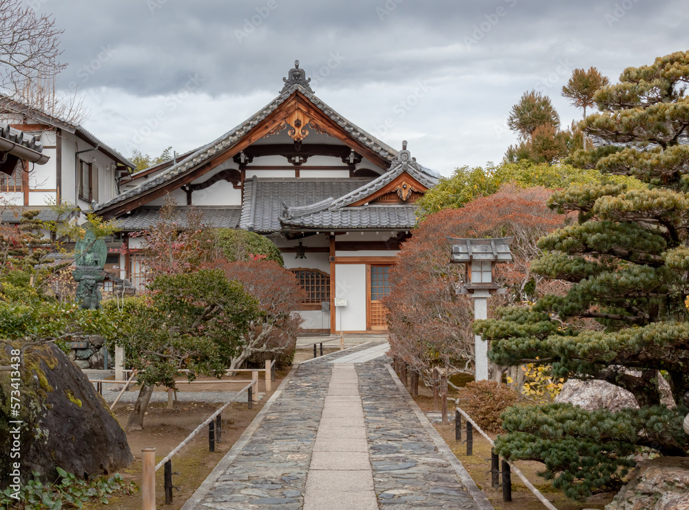 Traditional wooden buddhist temple building exterior architecture and garden of the Tenryu-ji Buddhist temple in Kyoto Japan