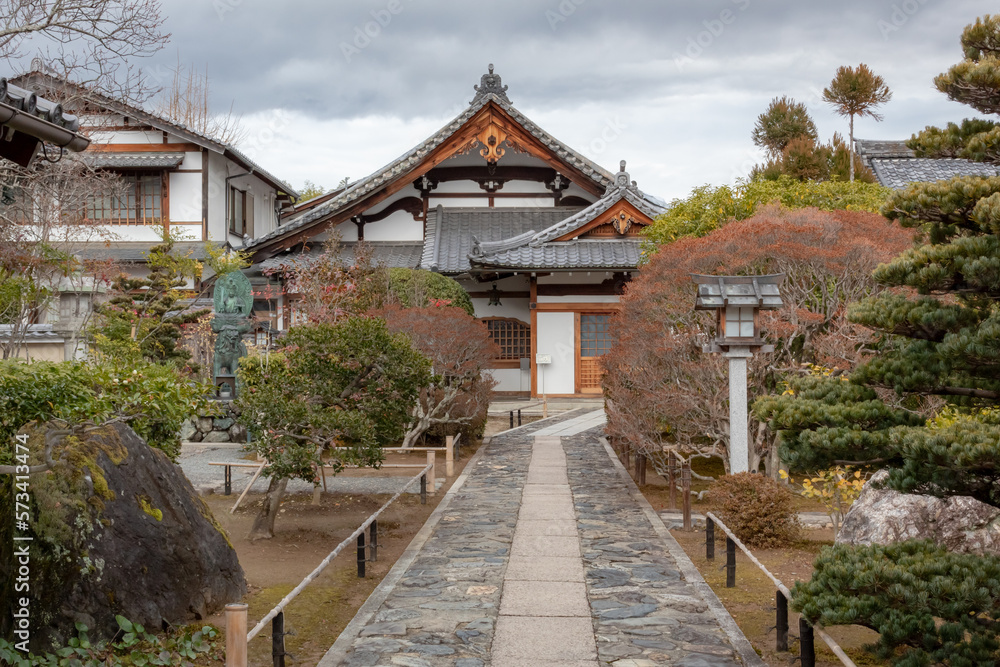 Traditional wooden buddhist temple building exterior architecture and garden of the Tenryu-ji Buddhist temple in Kyoto Japan