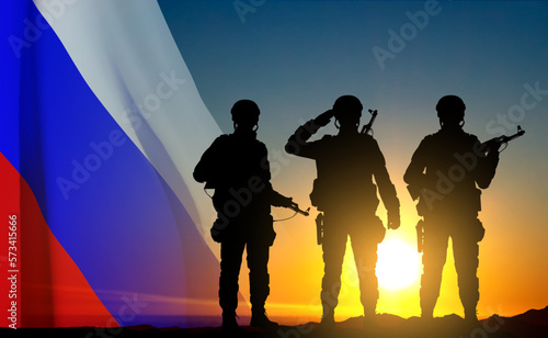 Silhouettes of russian soldiers on background of sunset with the Russian flag. Military recruitment concept. EPS10 vector