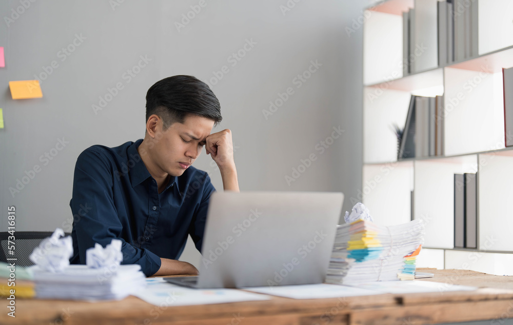 Mad crazy man employee sitting in office workplace with sticky notes all around, shouting furious angry, pissed off deadline and stressful job at office Mad crazy man employee sitting in office workplace with sticky notes all around, shouting furious angry, pissed off deadline and stressful job at office