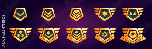 Cartoon set of game rank badge isolated on background. Vector illustration of shiny golden pentagonal medals decorated with stars and wings. Symbol of achievement, award for victory, trophy emblem