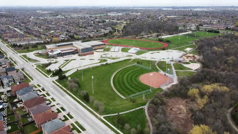 Aerial shot circling over baseball diamond in spring. Aerial shot circling over baseball diamond in spring.