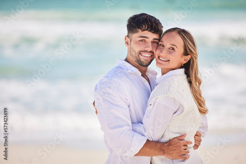 Portrait, love or couple hug at beach on holiday vacation or romantic honeymoon to celebrate marriage commitment. Travel, trust or woman bonding or hugging a happy partner in fun summer romance