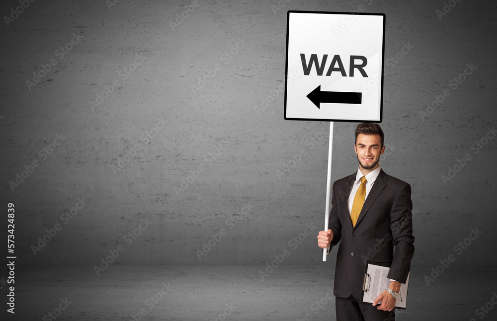 business person holding a traffic sign business person holding a traffic sign