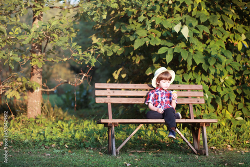 Leaf fall in the park. Children for a walk in the autumn park. Family. Fall. Happiness.