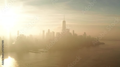 Aerial shot towards New York City financial district at sunrise from the Hudson river photo