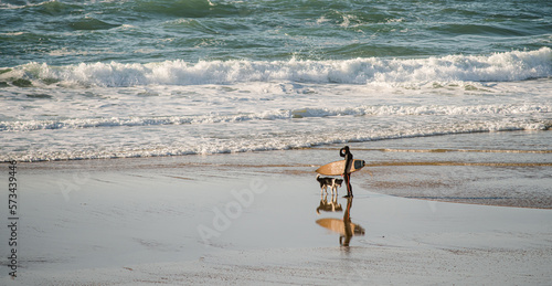 surfer and his dog on the beaches of south-west France