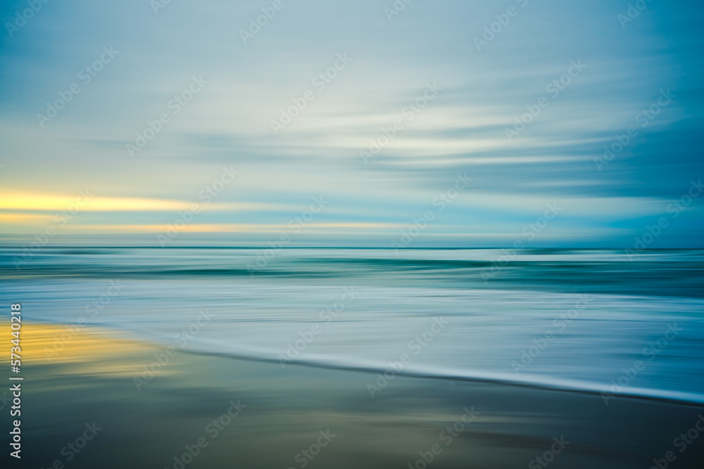 Sunset on the beach, abstract. Motion blur abstract seascape in light turquoise and yellow colors - obrazy, fototapety, plakaty 