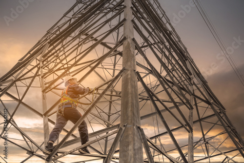 Obraz na plátně Asian electrical engineer wearing safety gear working high voltage pylon Enginee